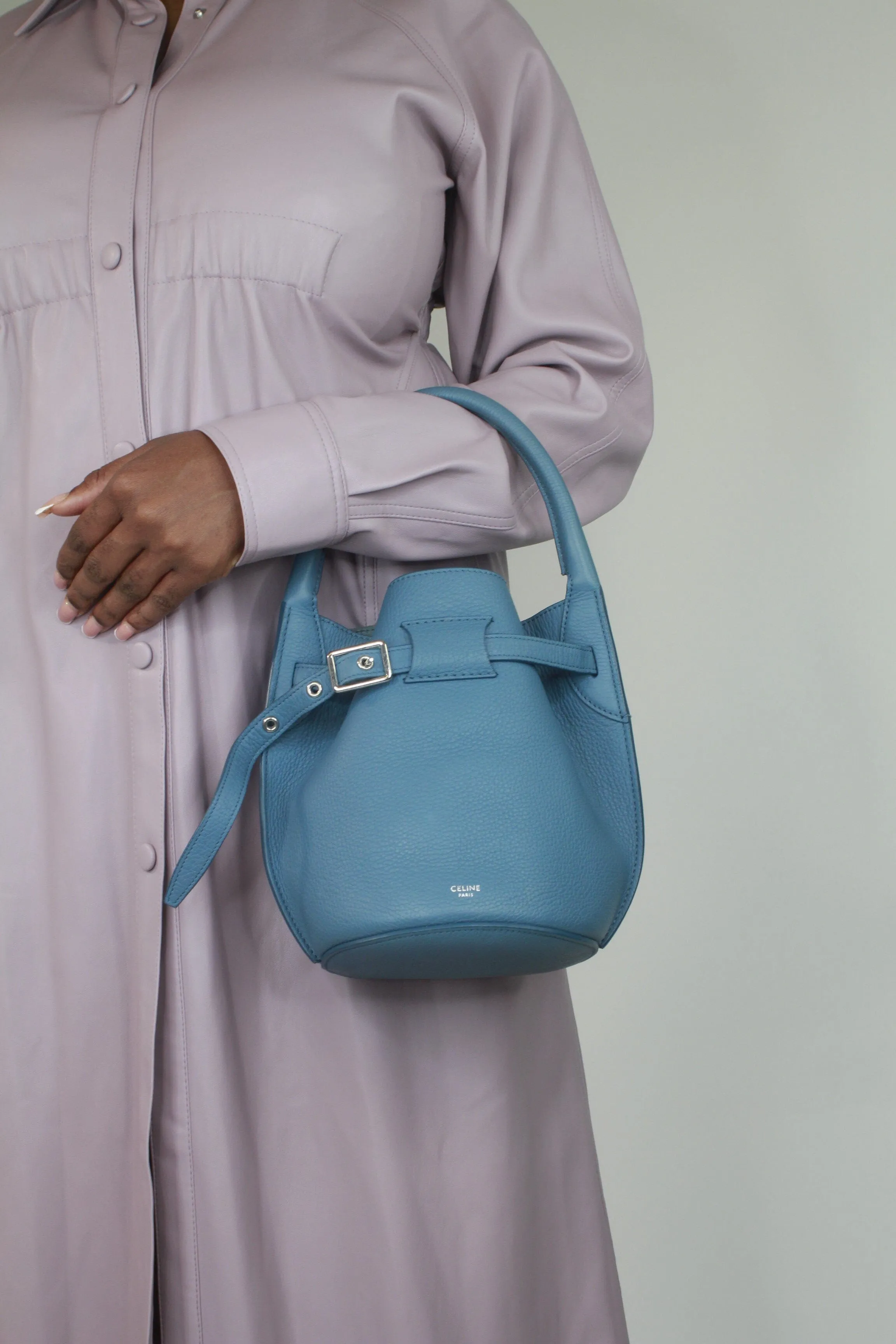 Blue buckled bucket top handle bag